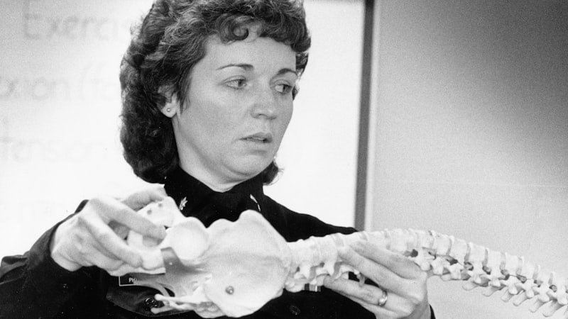 Reviewing a spine model during a consultation